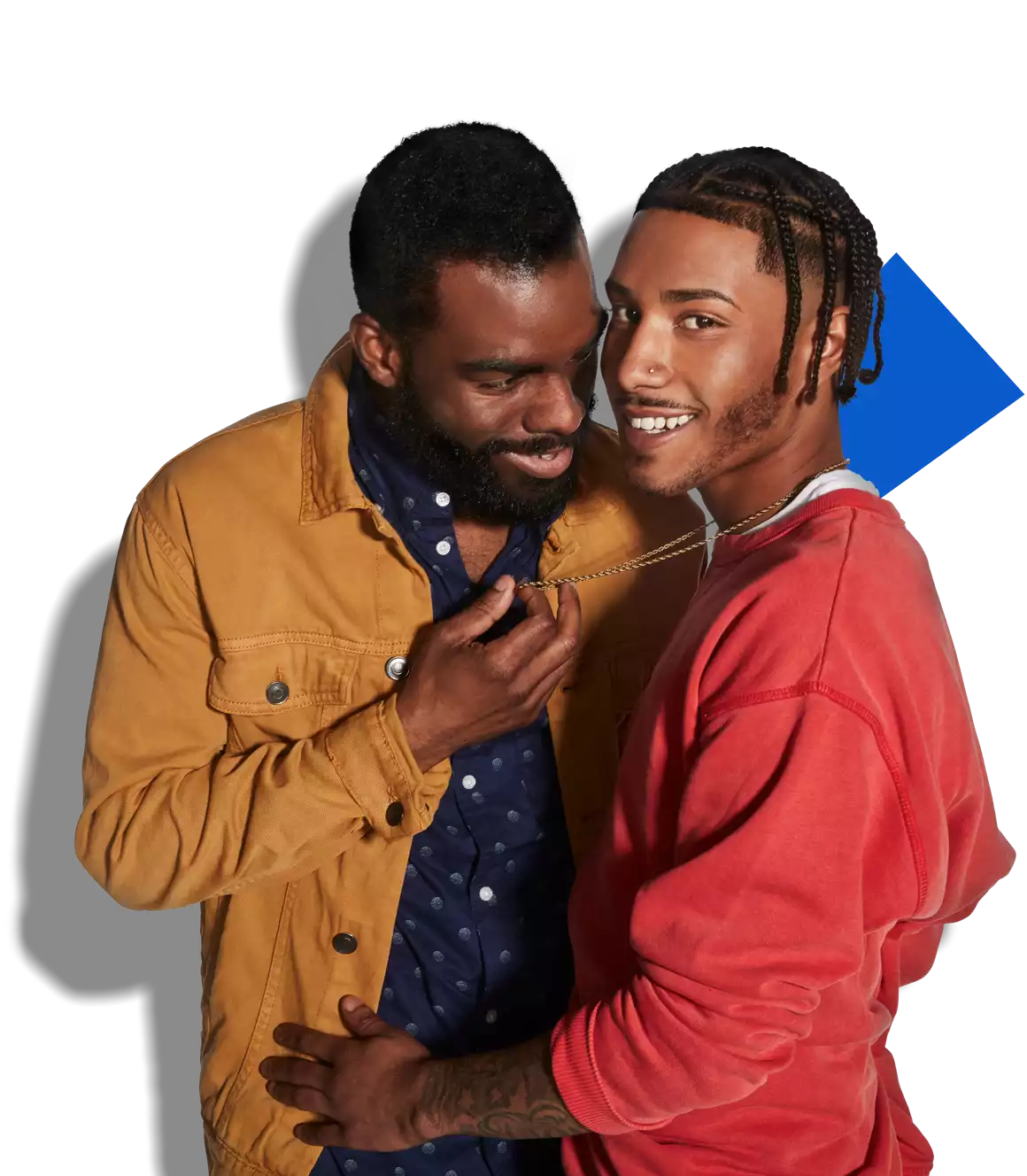 two gay men holding each other intimately and smiling