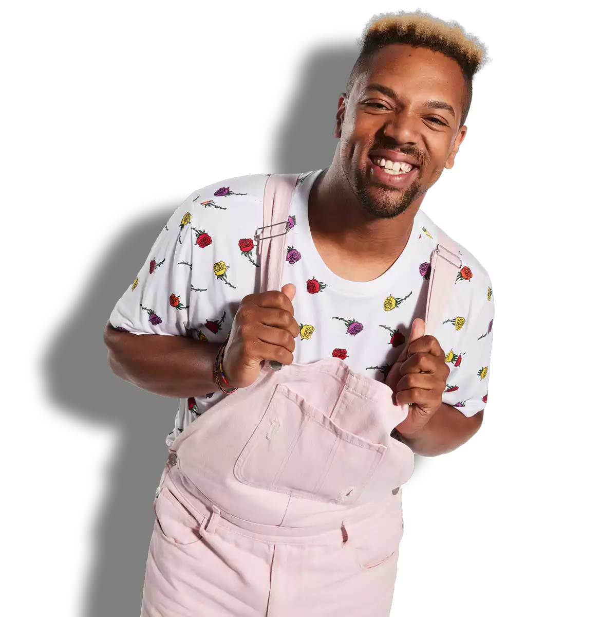 a man in pink overalls smiling